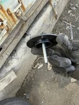 Genuine Nissan Spare Tire Clamp New 74810-JY01B For The Complete Lineup Used. Price: $15.00.
