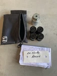 Honda Accord Alloy Wheel Locking Lug Nut W/ Case Set, Black Oem Used. Price: $25.00.